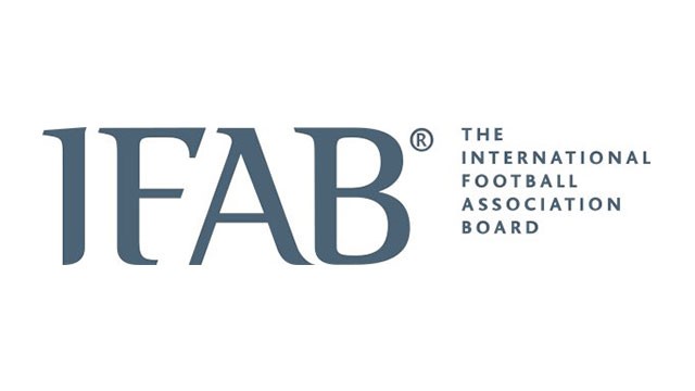Illustration of a soccer match showing new IFAB rules with a goalkeeper holding the ball for 8 seconds and players preparing for a corner kick.